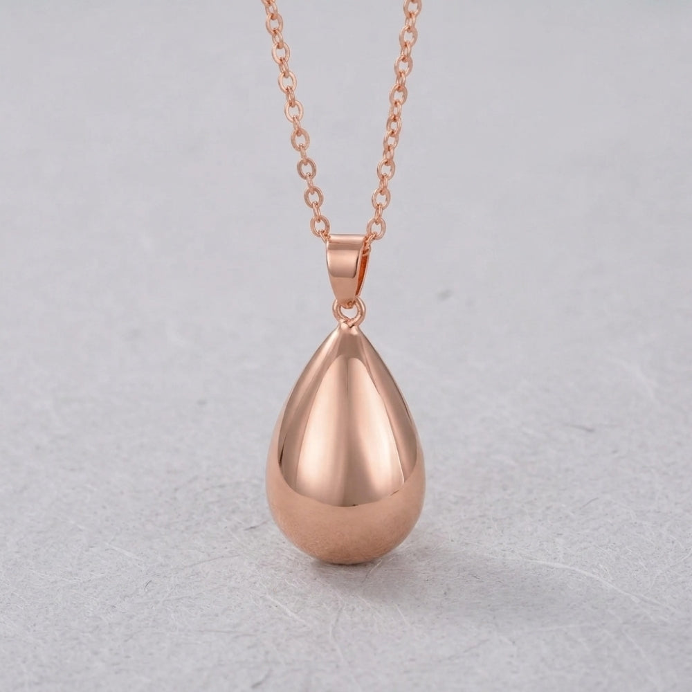 Bola de grossesse goutte or rose sur chaîne longue
