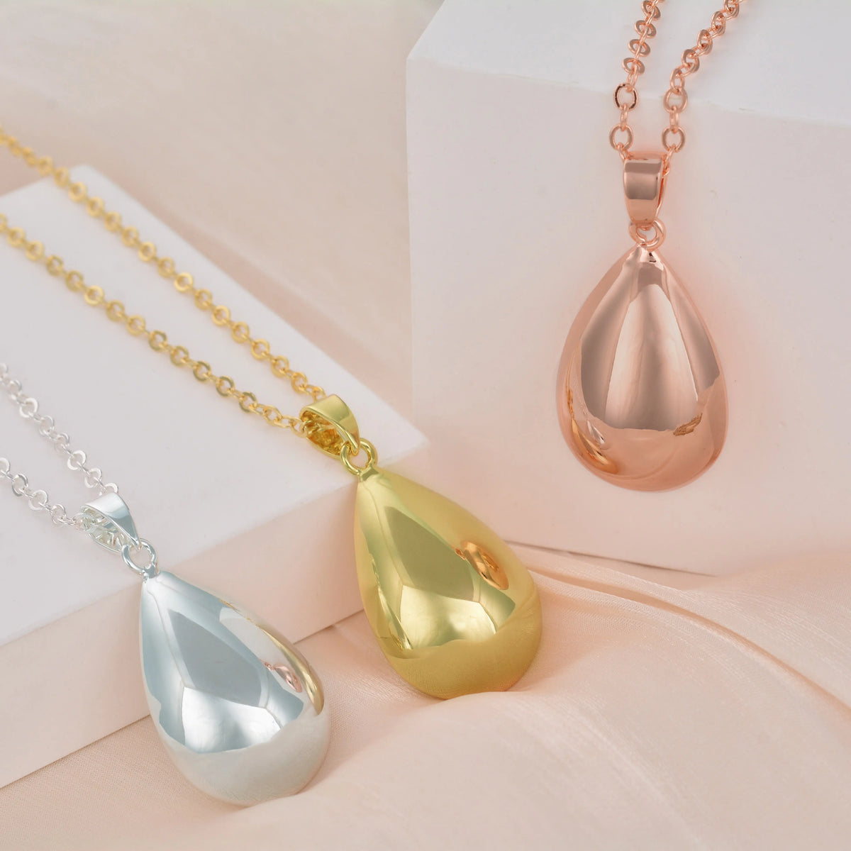 Bolas de grossesse goutte argenté, doré et or rose sur leurs chaînes